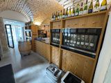 many bottles of wine on the shelves in this wine cellar