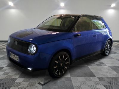 a picture of a blue car parked in a garage
