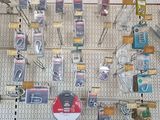 a display of electronics on the wall in a store