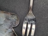 a fork and a spatula sitting on a table