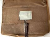 a brown bag that is sitting on top of a table
