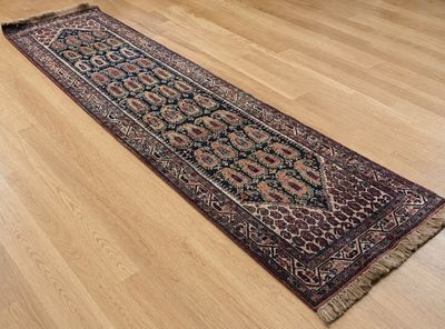 an image of a long oriental rug on a hard wood floor