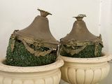 two vases that are sitting on a table
