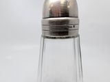an image of a glass salt shaker with a metal lid
