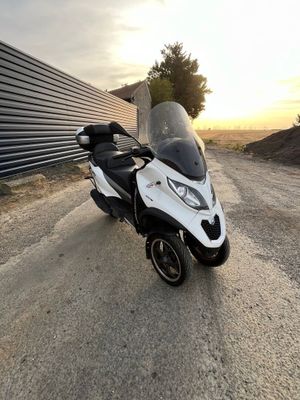 a motorcycle that is parked on the side of the road