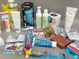 many different types of toothpaste and toothpaste products laid out on a table