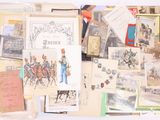 a pile of old postcards and other items on a table