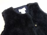 a picture of a black vest with buttons on it
