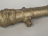 an old brass cannon on a white background