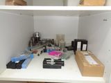 a white shelf with a bunch of different items on it