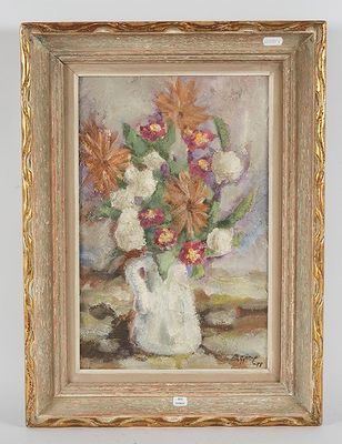 tableau représentant un vase de fleurs dans un cadre doré posé sur une table