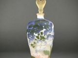 an image of a glass vase with flowers on it