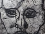 an image of a drawing of a man ' s face on a piece of paper