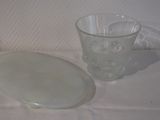 a glass with a lid next to a glass with a lid on it