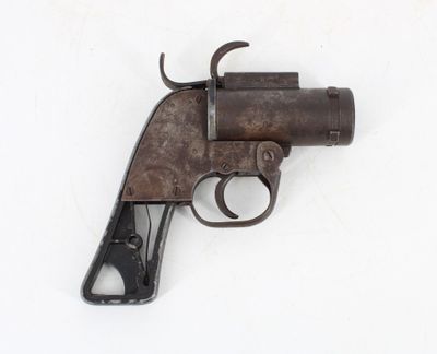 an old gun on a white surface with a white background