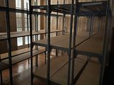 a room that has a bunch of shelves in it