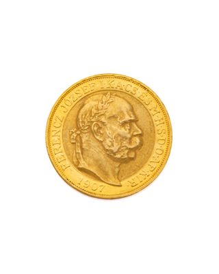 l'image d'une pièce d'or sur laquelle figure le visage d'un homme