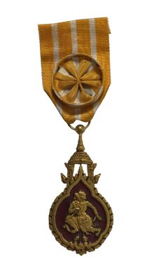 une image représentant une médaille d'or entourée d'un ruban rouge et blanc