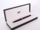 a picture of a pen in a box on a white surface