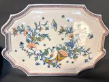 a plate with flowers and birds on it
