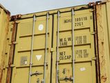 a large yellow container sitting on top of a truck