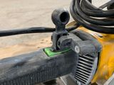a close up of a machine that has a hose attached to it