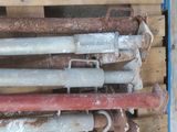 a pile of pipes sitting on top of a pallet