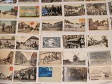 a lot of old postcards that are on the table