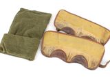 a pair of oven mitts sitting next to each other