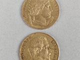 two gold coins, one of which has a woman ' s head and one of which is a man '