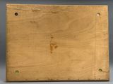 a close up of a wooden box with holes in it
