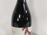 a bottle of wine that is sitting on a table