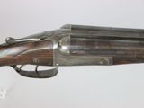 an old gun that is on display in a glass case