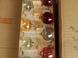 a box of christmas ornaments sitting on a table