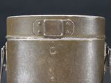 a metal container with a handle on a black background