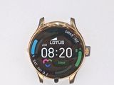 a close up of a smart watch on a white surface