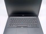 a laptop computer with a keyboard on a white surface