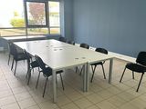 a room with a table and chairs in it