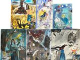 Plusieurs tableaux, de couleurs et de tailles variées, sont exposés sur une surface blanche