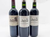 trois bouteilles de vin posées l'une à côté de l'autre sur une table