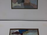 two paintings hanging on the wall next to each other