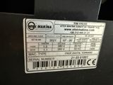 the label on the back of a machine shows the serial number of the machine