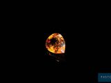 an orange diamond in the dark