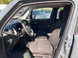 the interior of a car with the door open and the driver ' s seat down