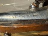 a close up of a gun that is on display