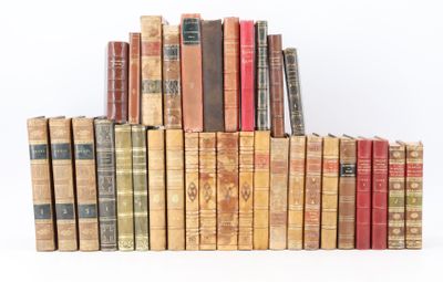a lot of old books stacked on top of each other