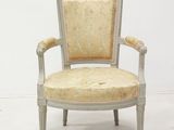an image of a white chair with a beige upholstered seat