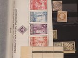 several different types of stamps are on display in a display case
