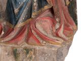 an old statue of a woman holding a baby in her arms