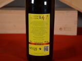 a bottle of wine that is sitting on a table